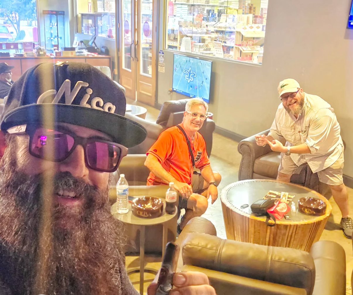 Craig with CigarProp and Tampa Stogie Steve in a cigar lounge, cigars in hand